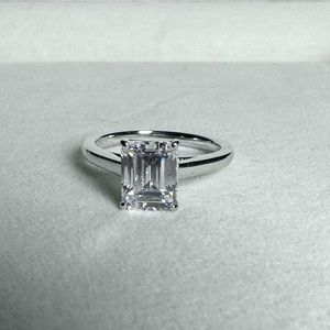 Emerald Cut CZ in Platinum Over 925 Sterling Silver.